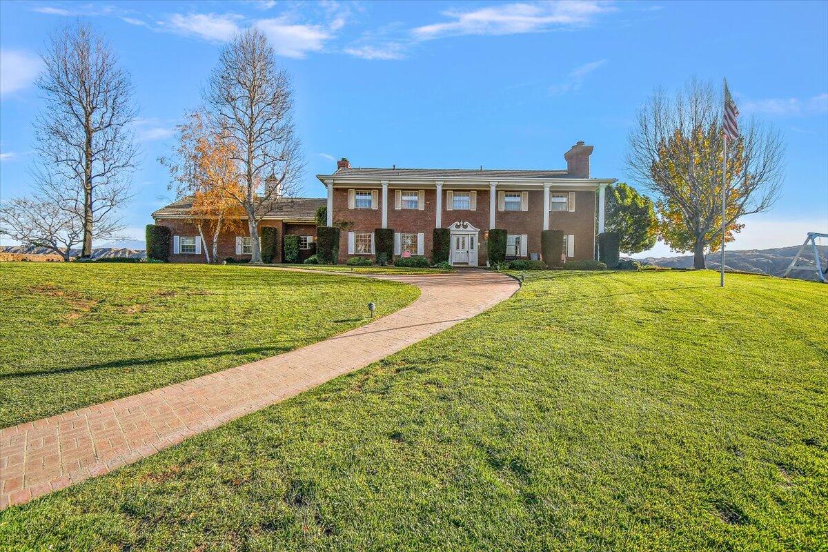 13292 Revello Road Redlands, CA 92373 - Photo 13 of 81 a view of a house with a big yard and large trees