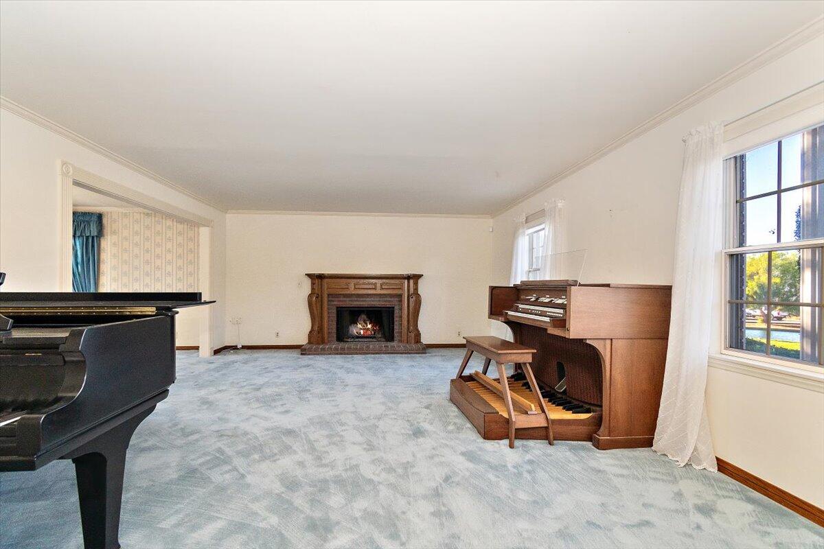 13292 Revello Road Redlands, CA 92373 - Photo 17 of 81 a living room with furniture a fireplace and a window