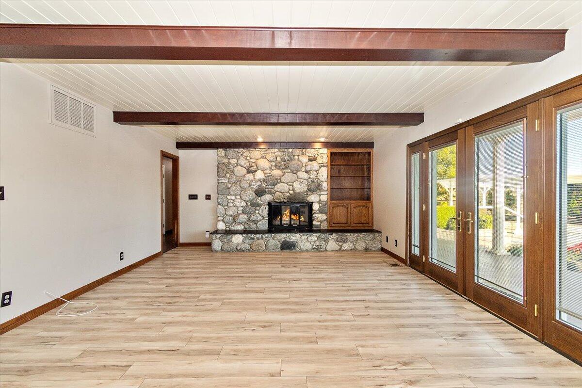 13292 Revello Road Redlands, CA 92373 - Photo 24 of 81 a view of an empty room with wooden floor and a window