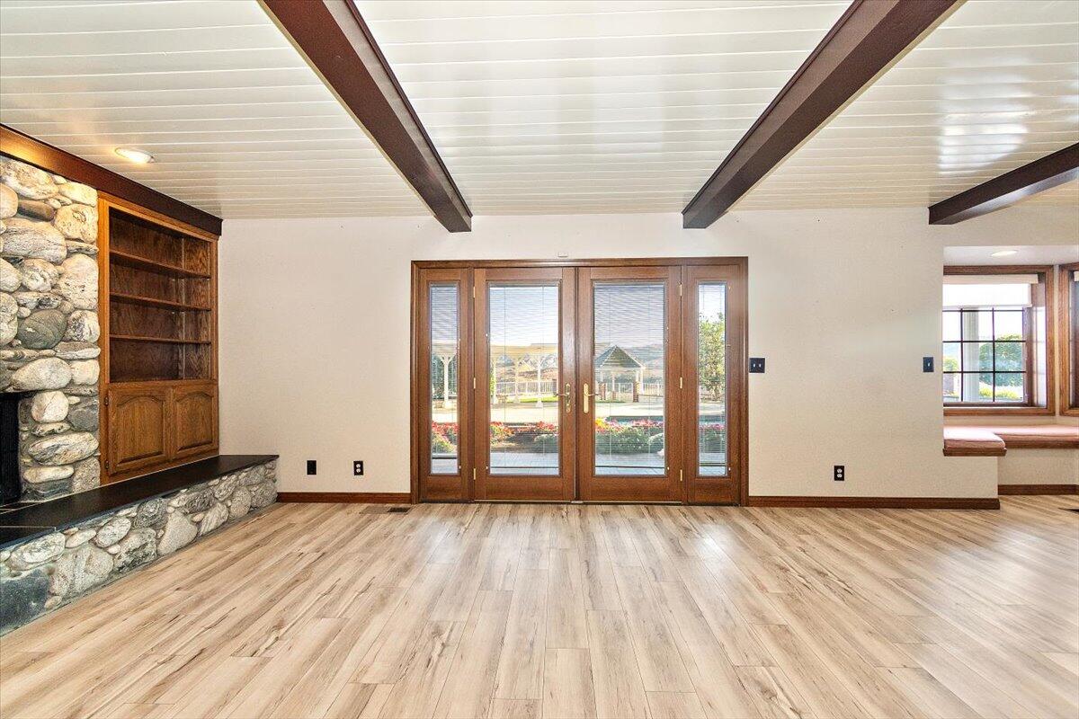 13292 Revello Road Redlands, CA 92373 - Photo 27 of 81 a view of an empty room with wooden floor and a window