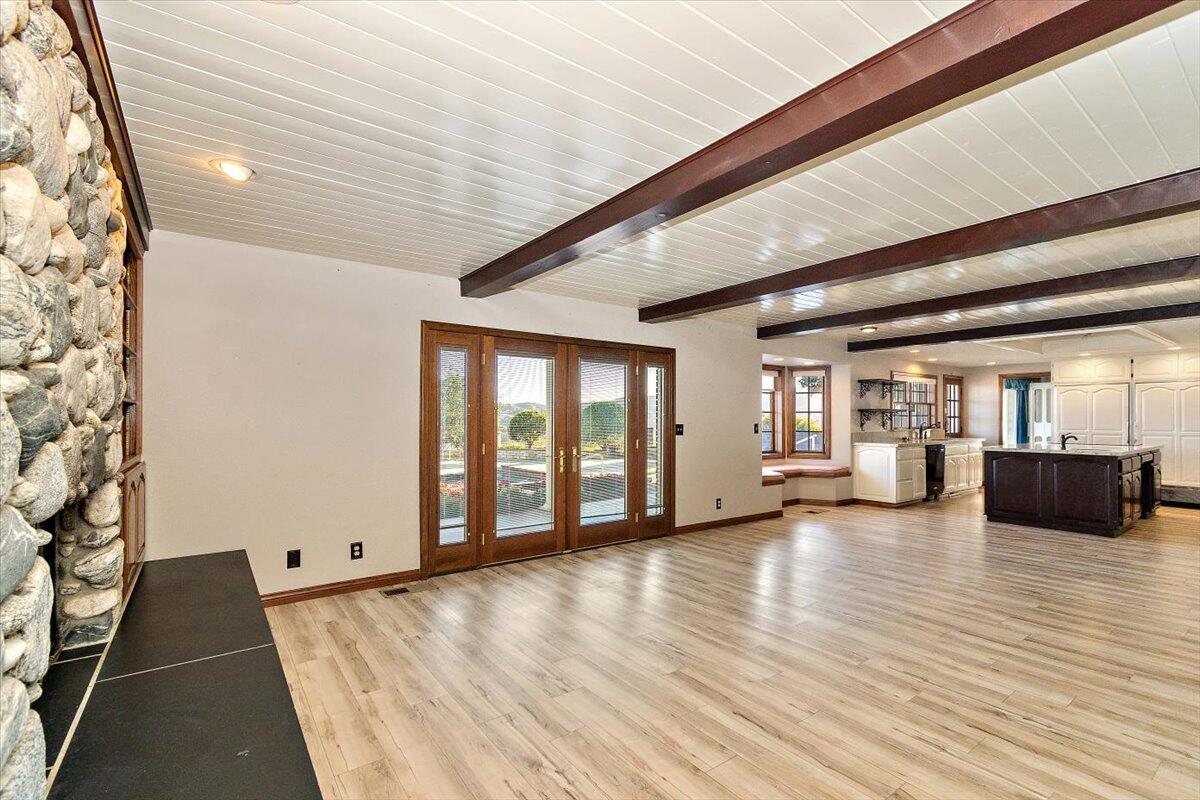 13292 Revello Road Redlands, CA 92373 - Photo 28 of 81 a view of an empty room with wooden floor and a window