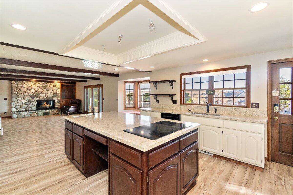 13292 Revello Road Redlands, CA 92373 - Photo 30 of 81 a kitchen with granite countertop a sink and cabinets with wooden floor