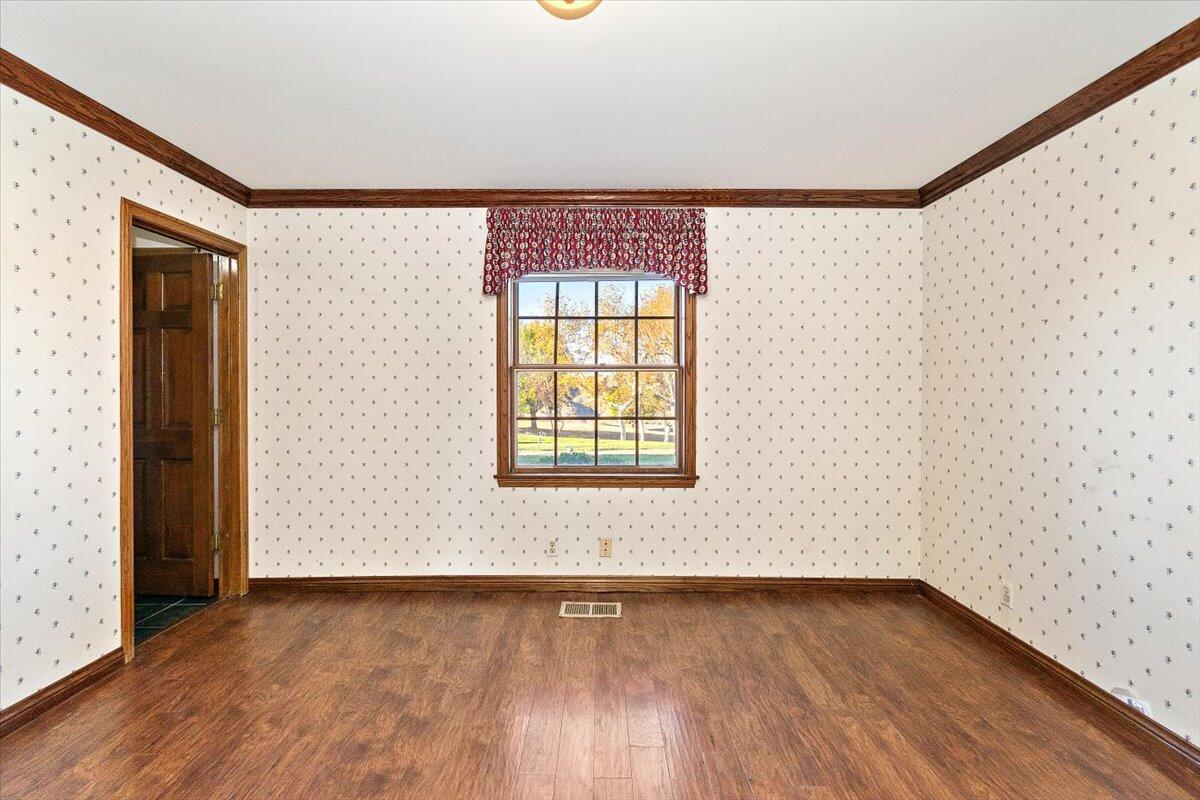 13292 Revello Road Redlands, CA 92373 - Photo 35 of 81 an empty room with wooden floor and windows