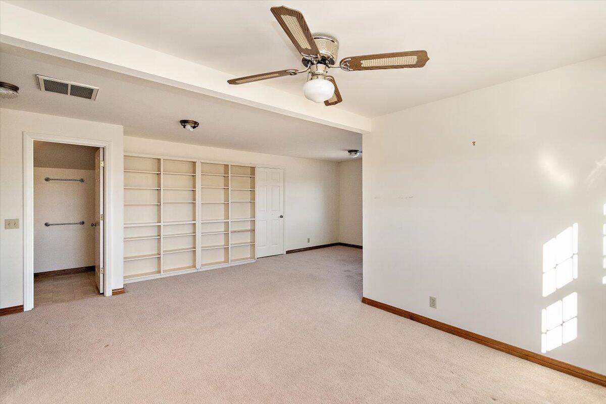 13292 Revello Road Redlands, CA 92373 - Photo 40 of 81 an empty room with a ceiling fan and window