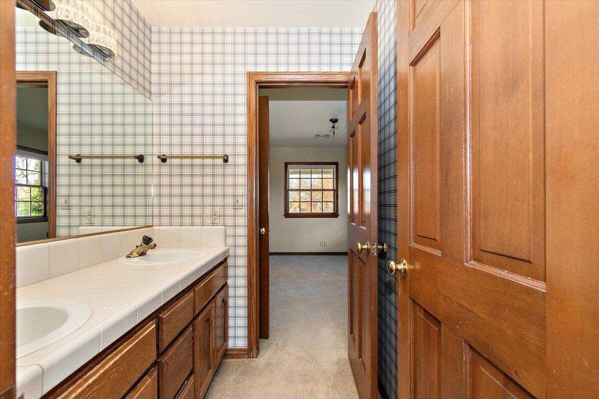 13292 Revello Road Redlands, CA 92373 - Photo 53 of 81 a bathroom with a sink a toilet and shower