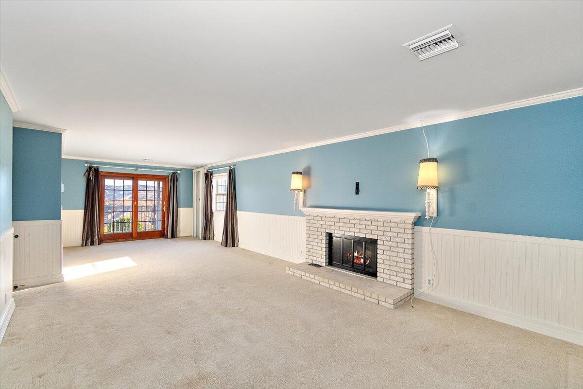 13292 Revello Road Redlands, CA 92373 - Photo 61 of 81 an empty room with windows and fireplace