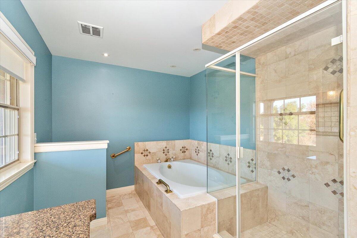13292 Revello Road Redlands, CA 92373 - Photo 66 of 81 a bathroom with a bathtub and a shower