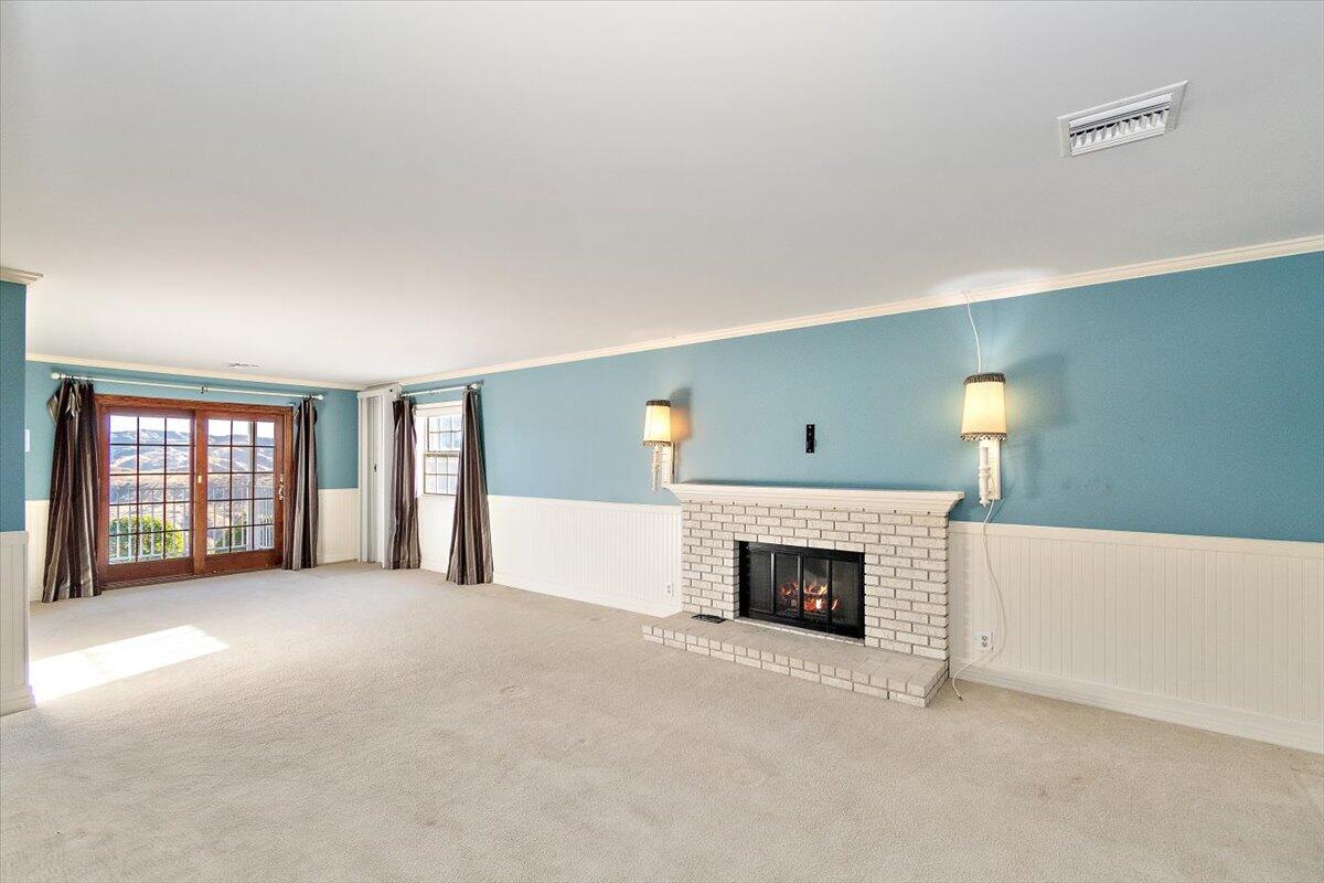 13292 Revello Road Redlands, CA 92373 - Photo 69 of 81 a view of an empty room with a fireplace and a window