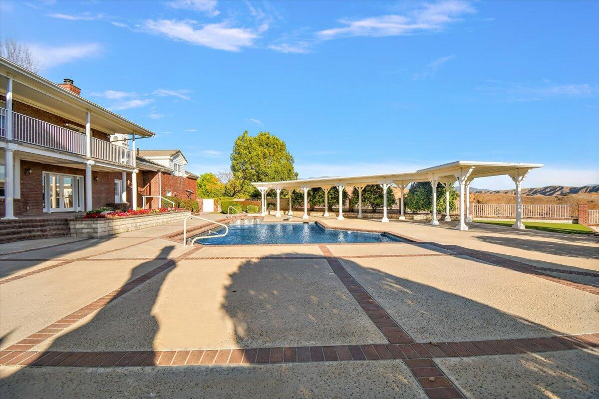 13292 Revello Road Redlands, CA 92373 - Photo 74 of 81 a view of a swimming pool with outdoor seating