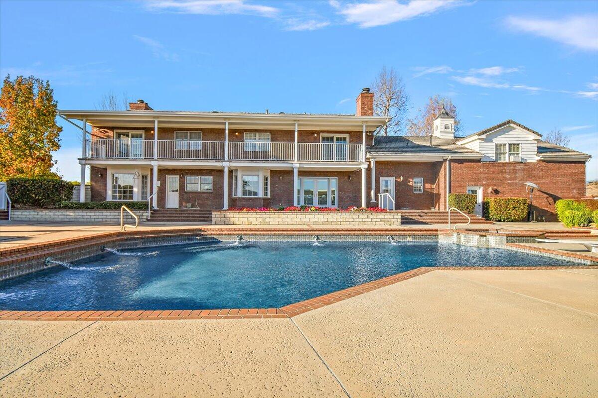 13292 Revello Road Redlands, CA 92373 - Photo 77 of 81 front view of a house with a swimming pool