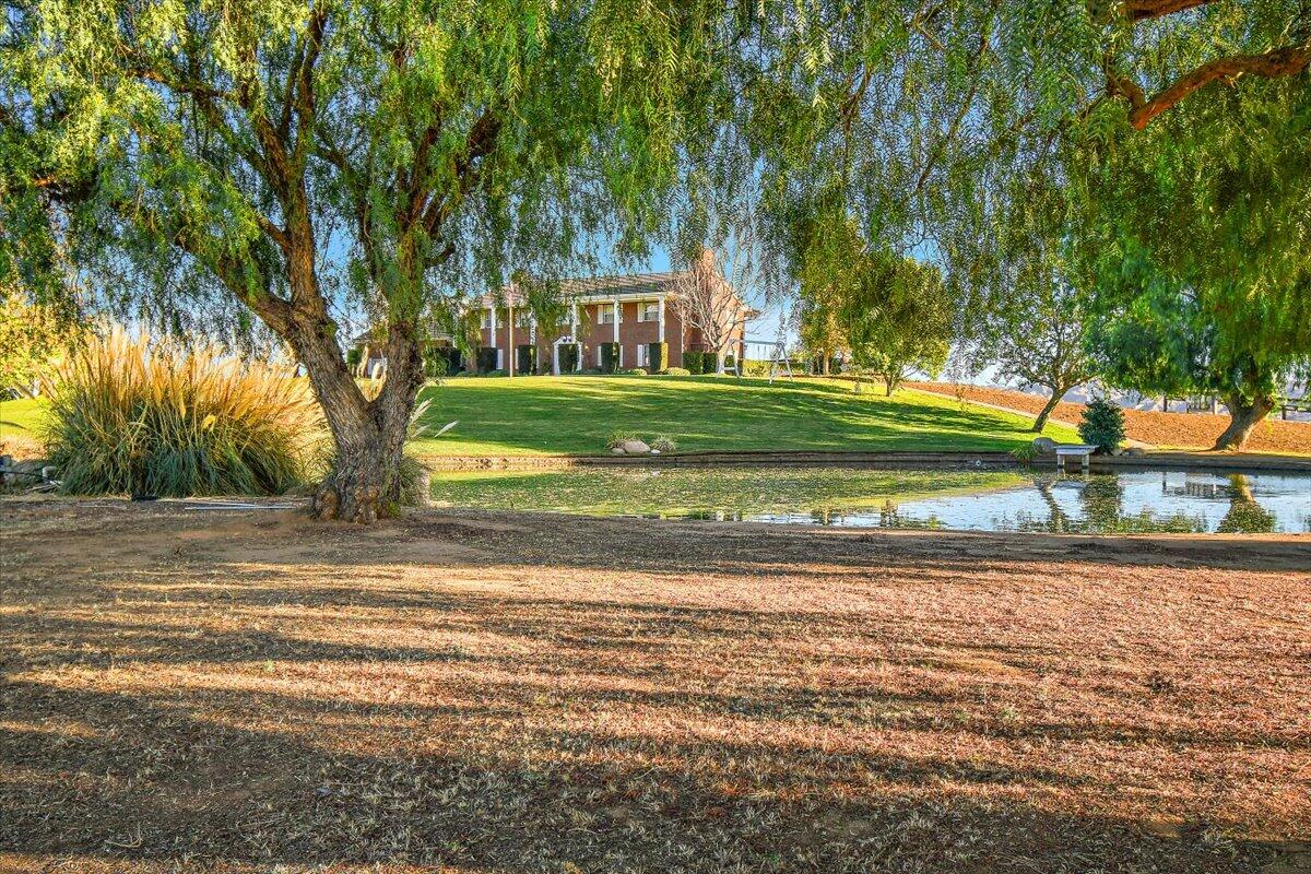 13292 Revello Road Redlands, CA 92373 - Photo 81 of 81 a view of a house in the middle of a yard