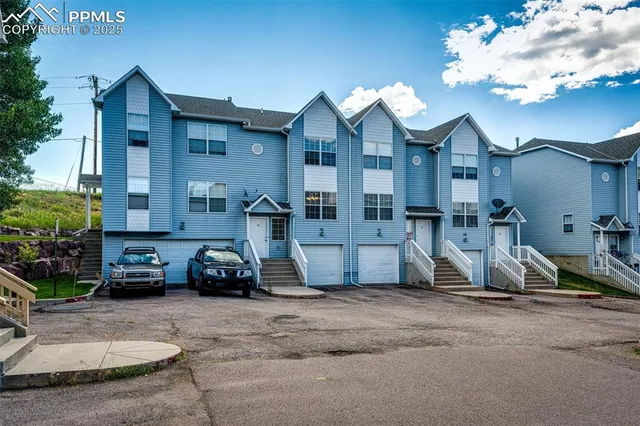 a view of a parked cars in front of a house