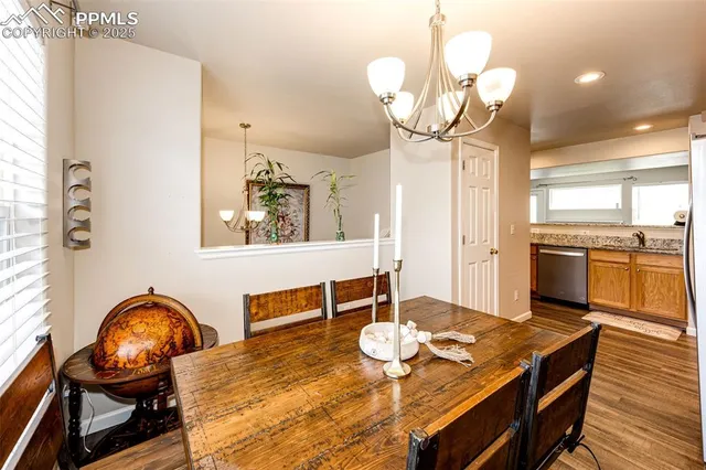 a view of a dining room with furniture and wooden floor