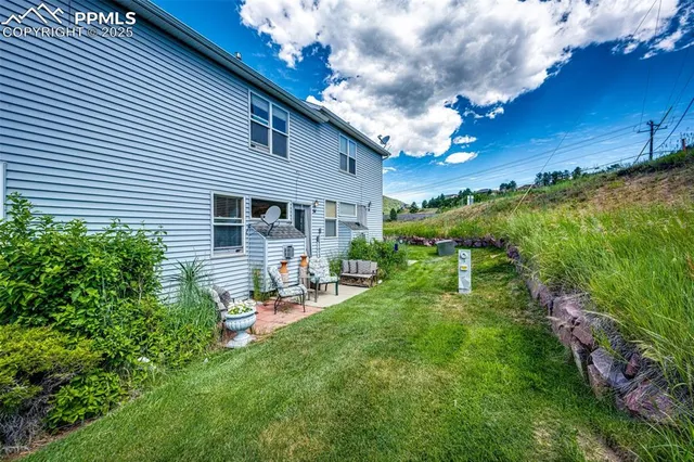 a backyard of a house with seating space