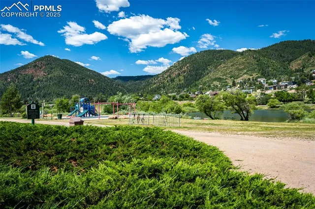 a view of an swimming pool a yard and a fountain