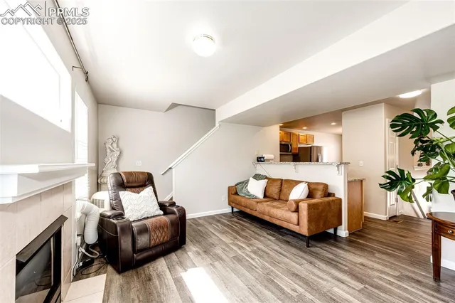 a bedroom with furniture and a wooden floor