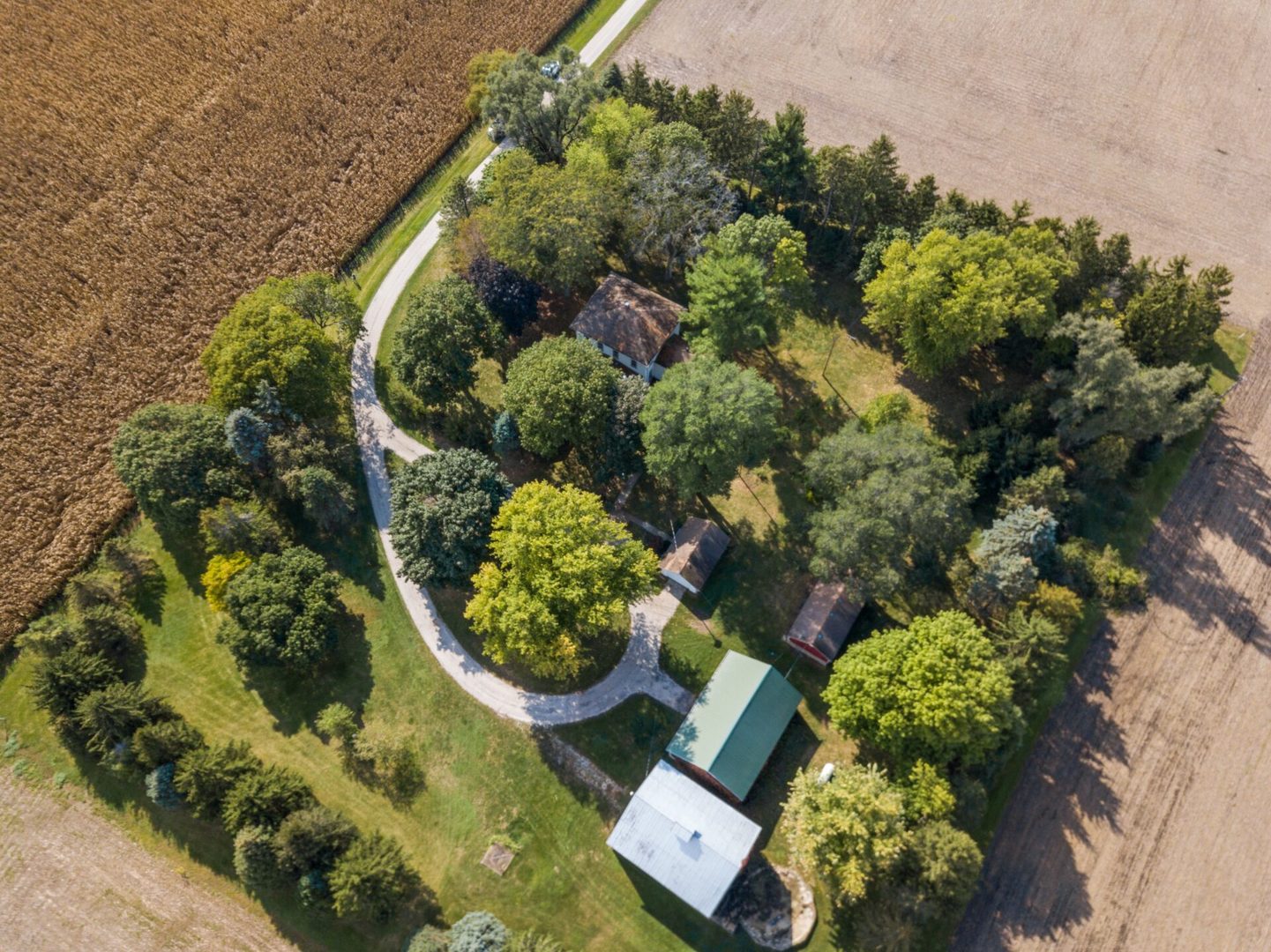 560 B Vilmin Road Plano, IL 60545 - Photo 1 of 36 an aerial view of a house with a yard and garden