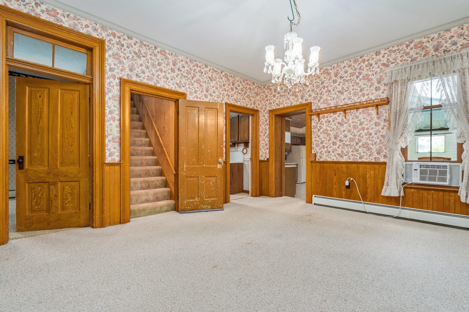 560 B Vilmin Road Plano, IL 60545 - Photo 15 of 36 en empty room with chandelier and windows
