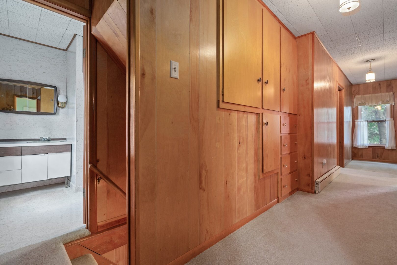 560 B Vilmin Road Plano, IL 60545 - Photo 23 of 36 a view of a hallway with stainless steel appliances granite countertop cabinets and a window