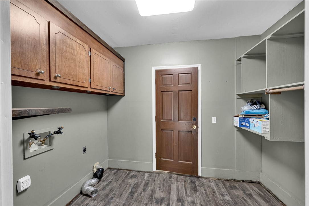 433 Latham Road Easley, SC 29640 - Photo 19 of 50 Ample storage solutions and durable flooring define this practical laundry space.