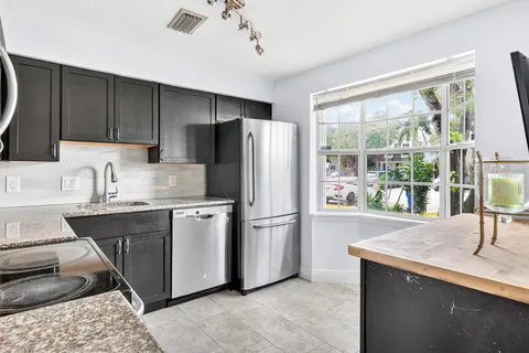 a kitchen with a stove and a sink