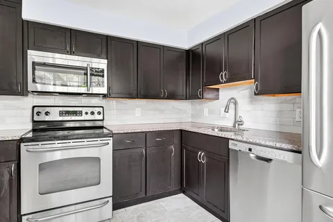 a en suite bathroom with a sink and a mirror