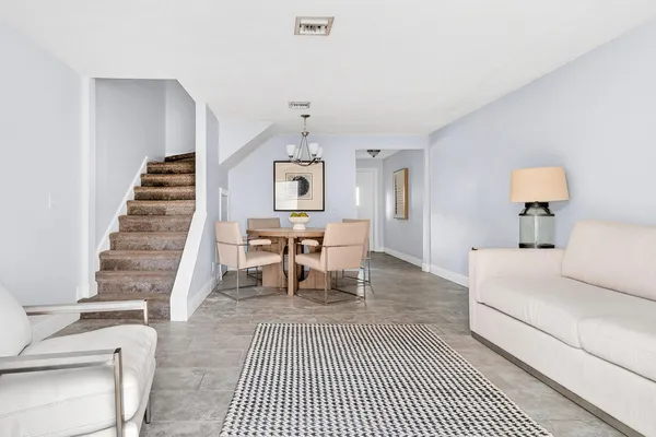 a living room with furniture and a rug