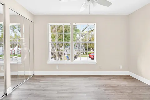 a bathroom with a sink toilet vanity and tub