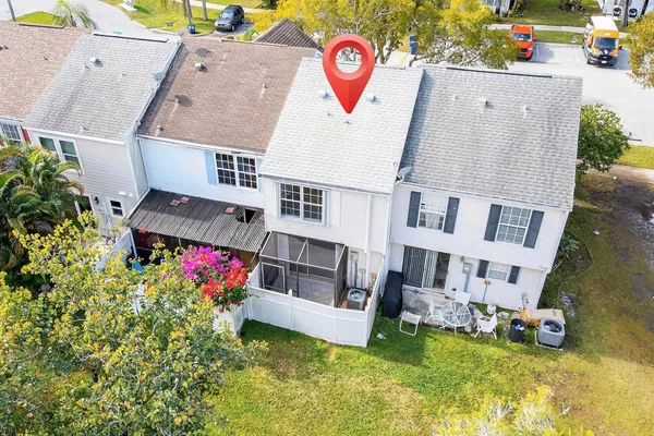 an aerial view of residential house with swimming pool and outdoor space