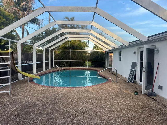 a view of outdoor space with wooden fence