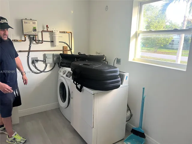 a utility room with dryer and washer