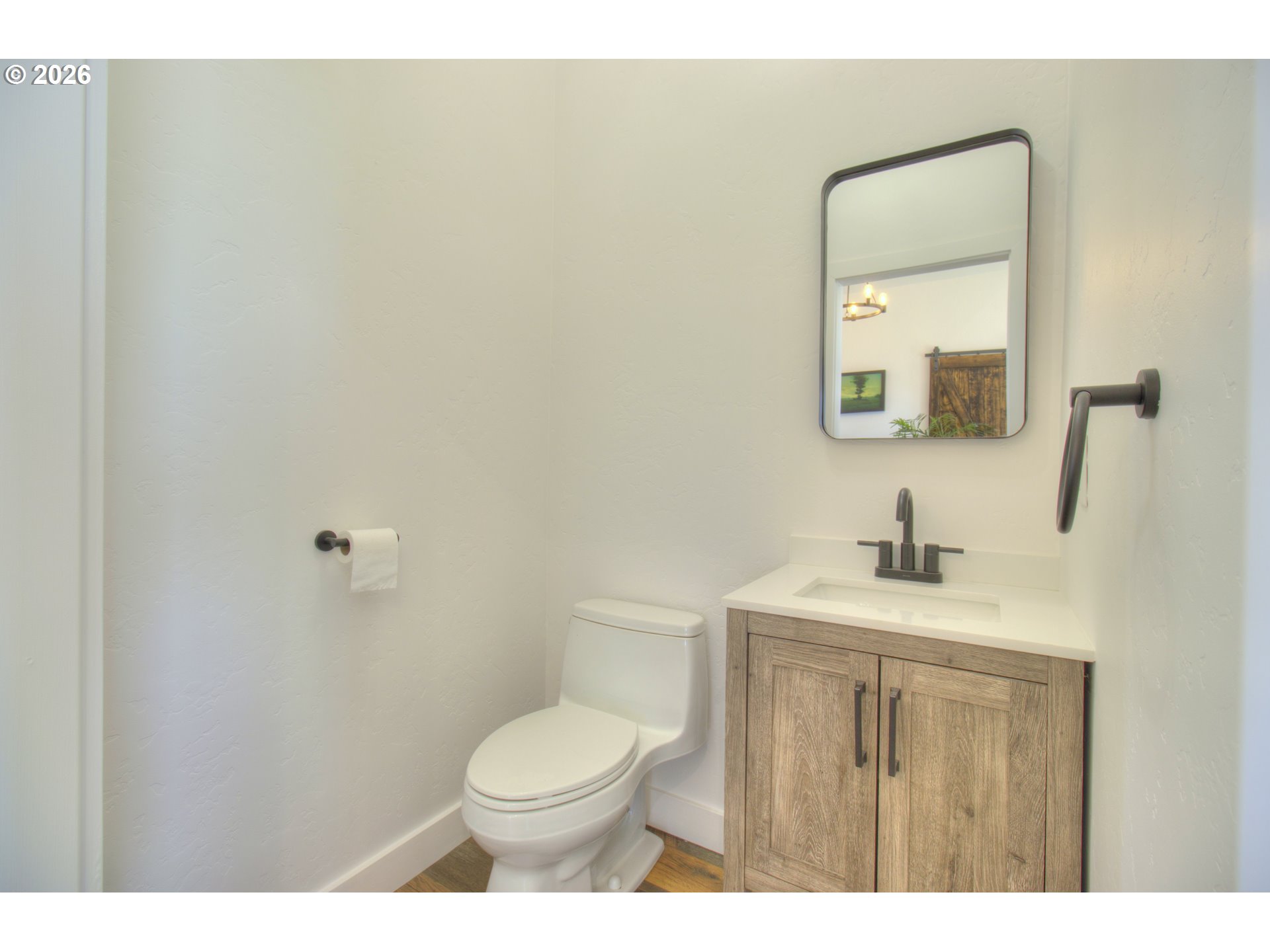 95660 Spirit Ridge Road Gold Beach, OR 97444 - Photo 14 of 34 a bathroom with a toilet a sink a mirror and vanity