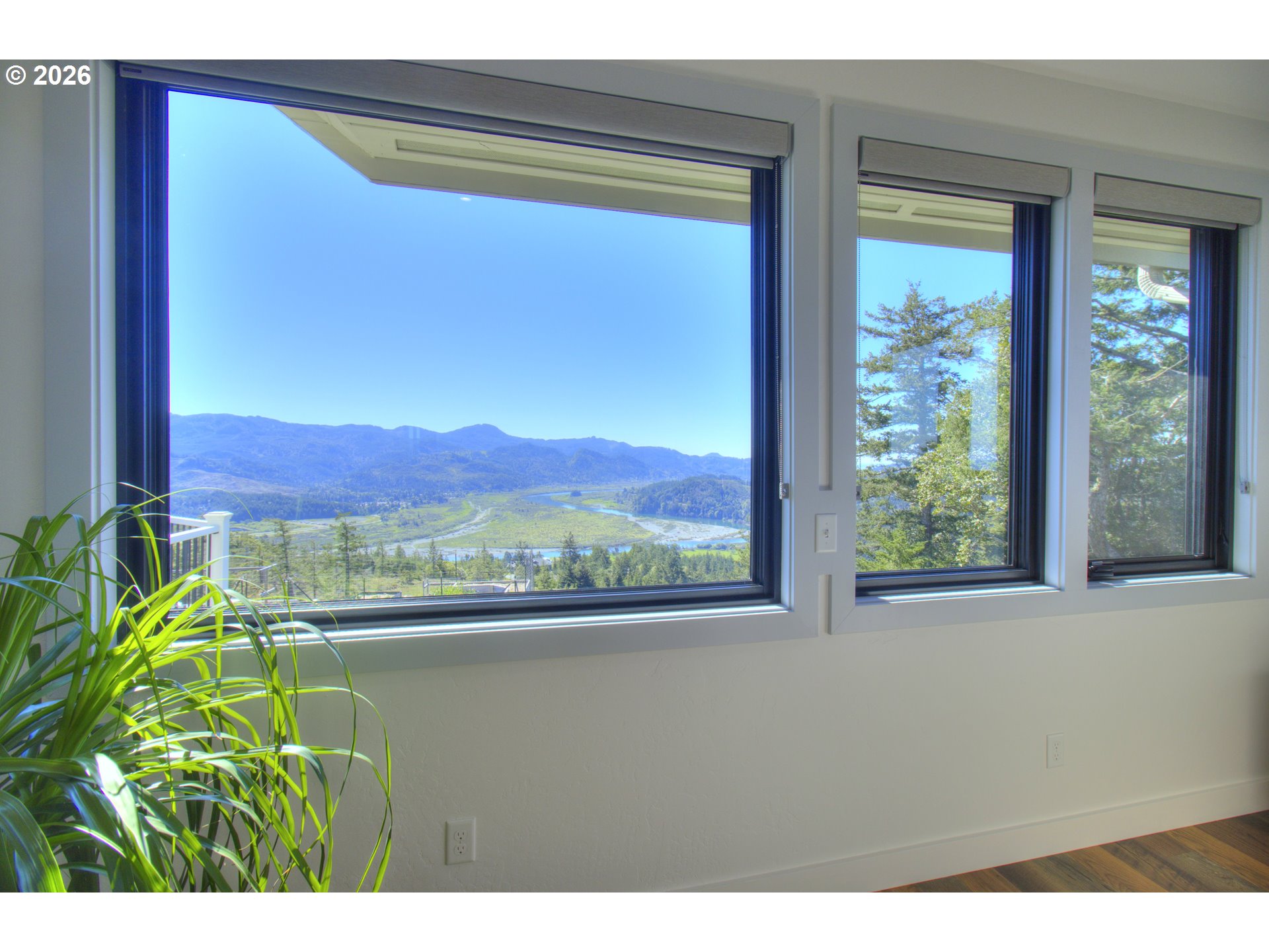 95660 Spirit Ridge Road Gold Beach, OR 97444 - Photo 17 of 34 a view of a lake from a window
