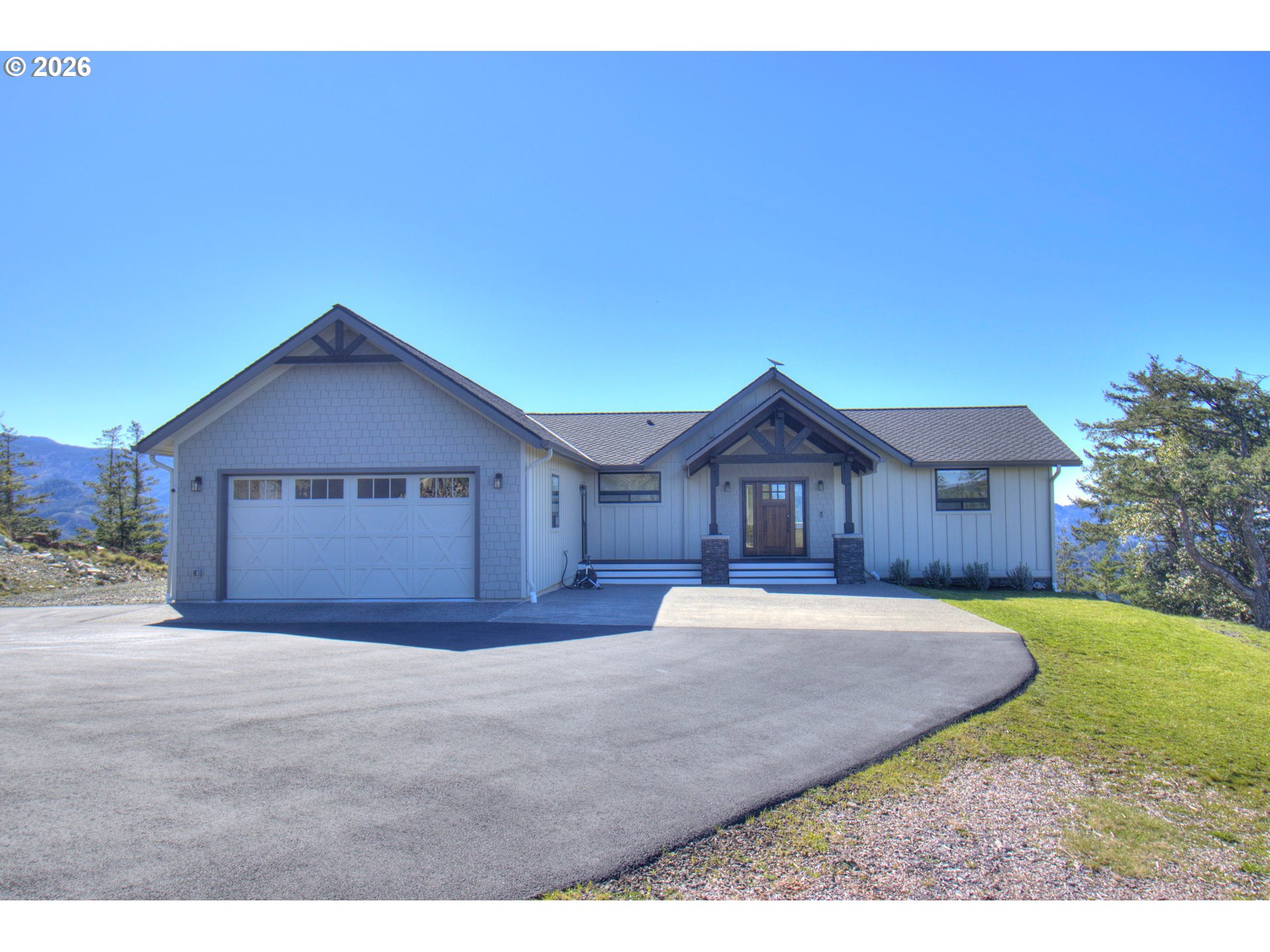 95660 Spirit Ridge Road Gold Beach, OR 97444 - Photo 2 of 34 a house view with a outdoor space