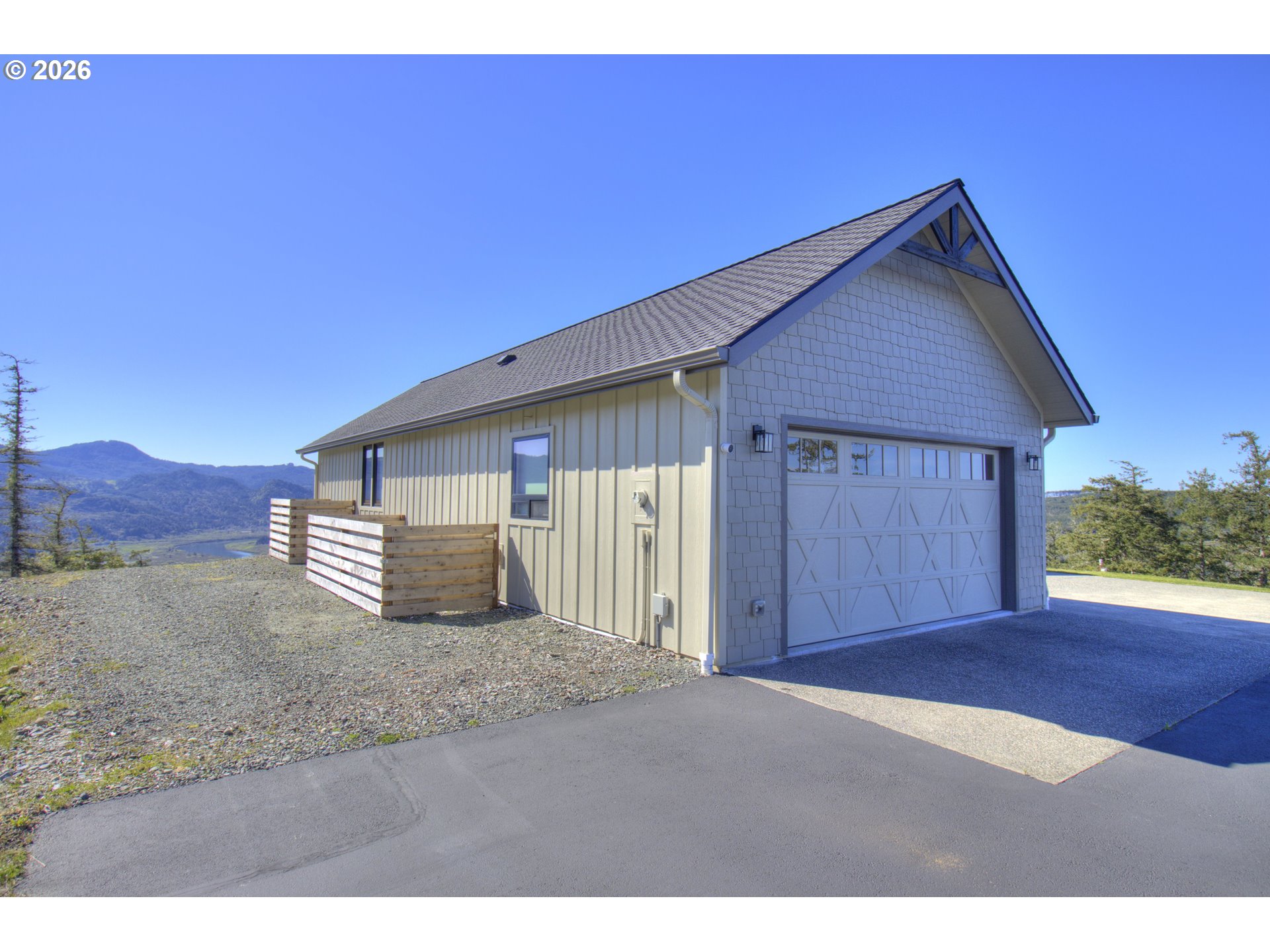95660 Spirit Ridge Road Gold Beach, OR 97444 - Photo 29 of 34 a view of a house with a yard