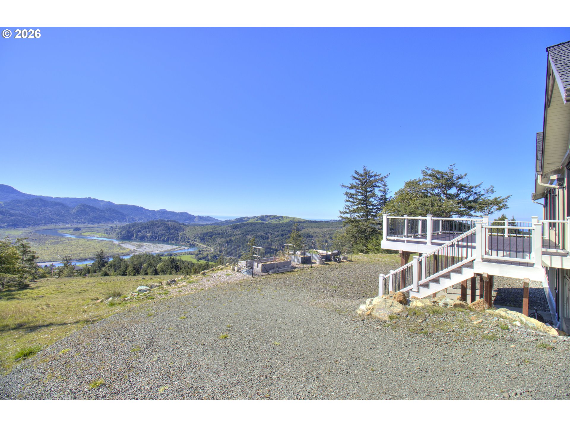 95660 Spirit Ridge Road Gold Beach, OR 97444 - Photo 30 of 34 a view of a house with a yard