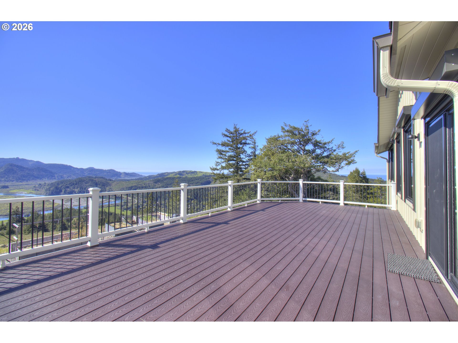 95660 Spirit Ridge Road Gold Beach, OR 97444 - Photo 31 of 34 a view of balcony with wooden floor and fence