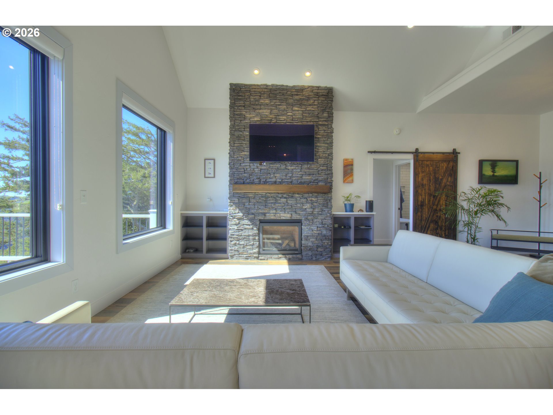 95660 Spirit Ridge Road Gold Beach, OR 97444 - Photo 6 of 34 a living room with furniture and a fireplace