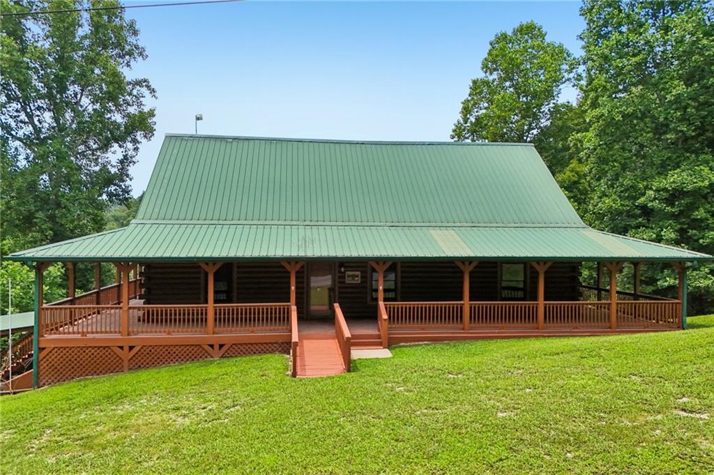 1384 Crystal Lane Northeast Ranger, GA 30734 - Photo 66 of 89 a front view of a house with a garden