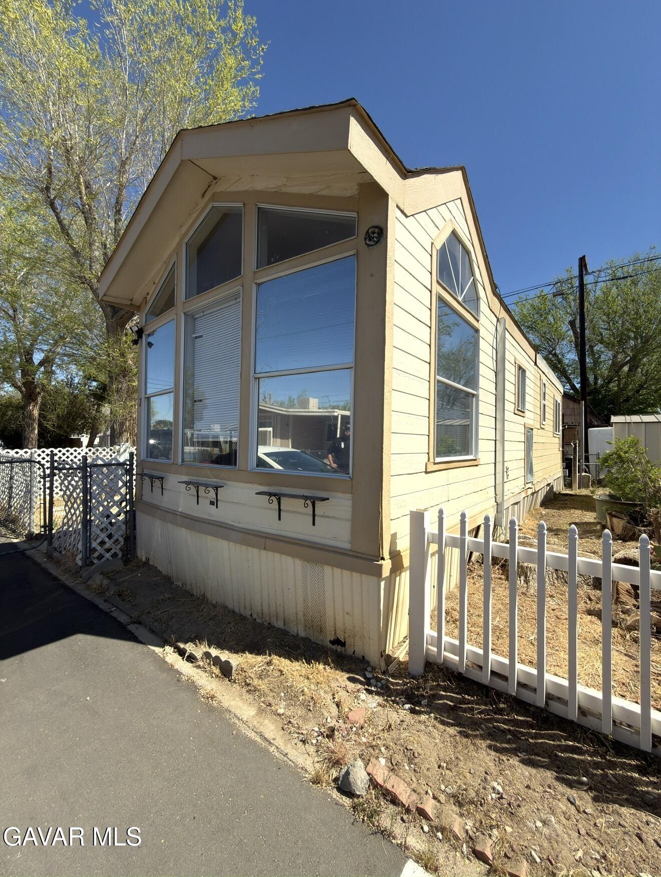 45446 7th Street East Lancaster, CA 93535 - Photo 2 of 6 a front view of a house with a yard