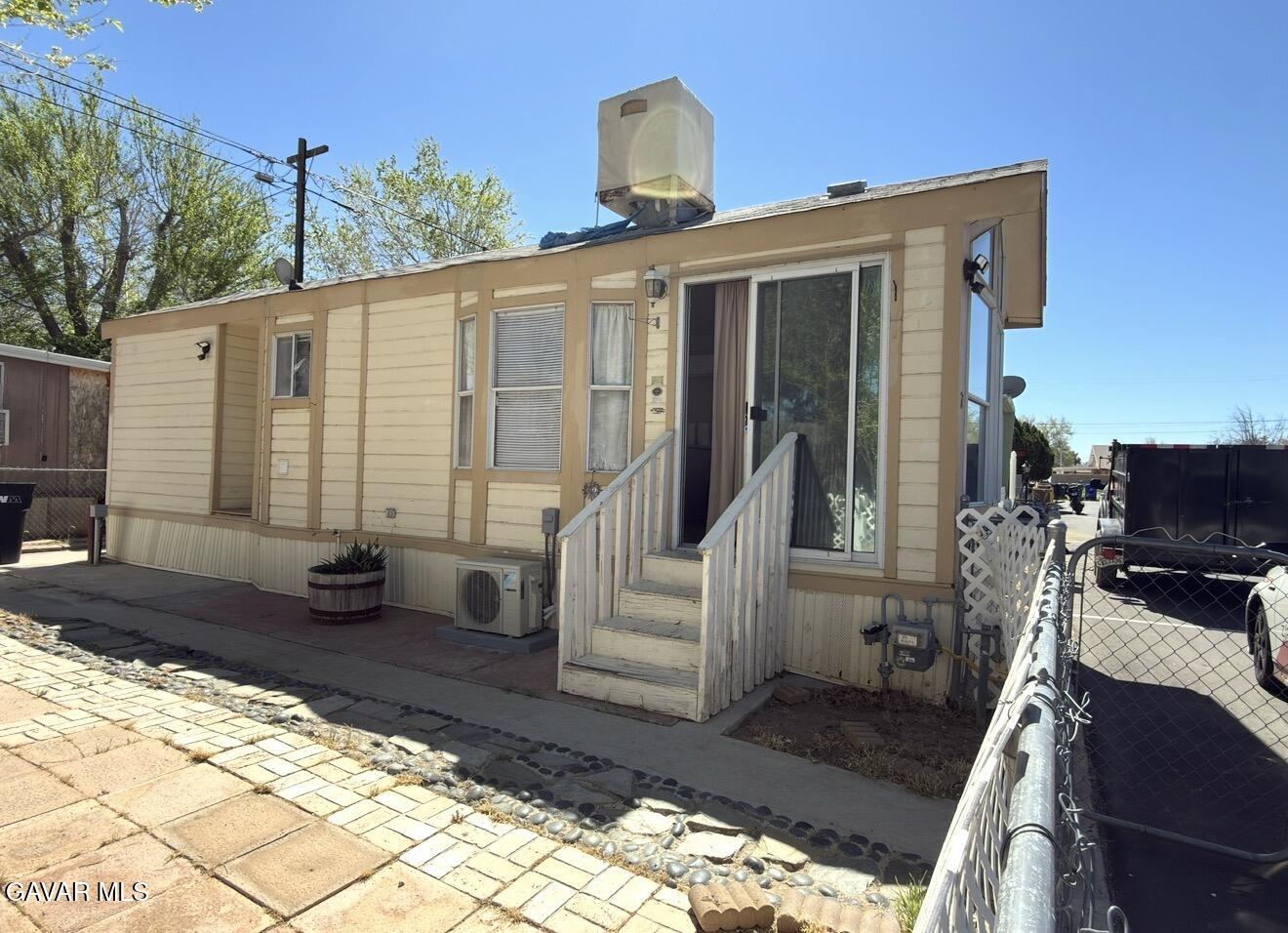 45446 7th Street East Lancaster, CA 93535 - Photo 3 of 6 a front view of a house with a yard
