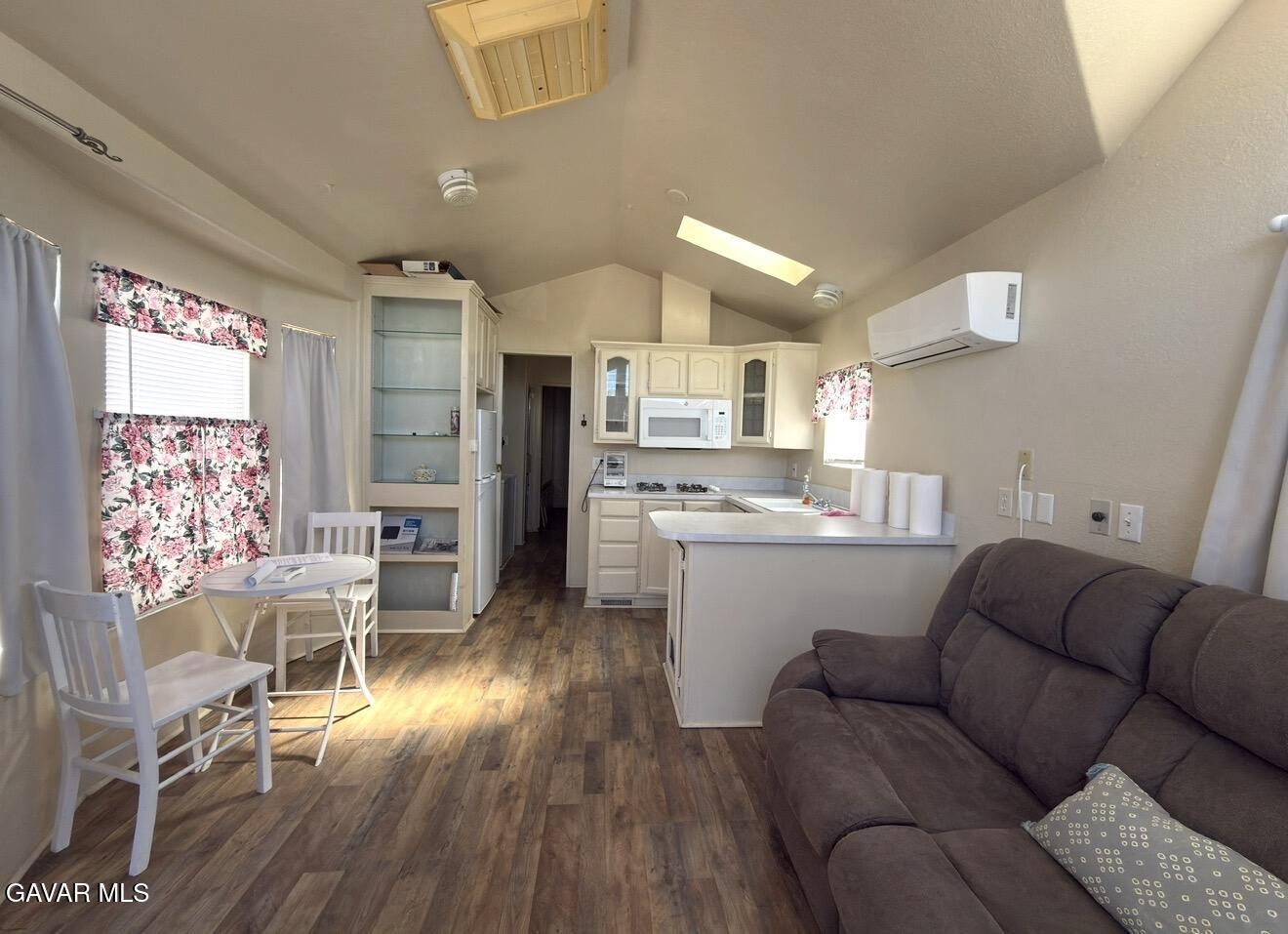 45446 7th Street East Lancaster, CA 93535 - Photo 4 of 6 a living room with furniture and wooden floor