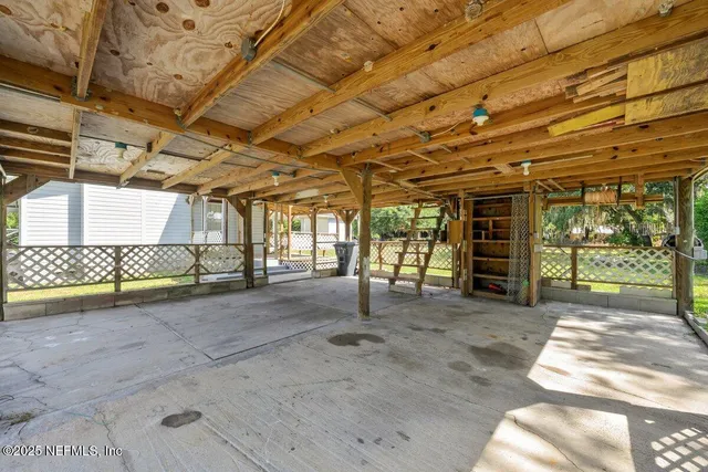 a view of a room with wooden walls