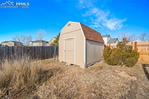 a pathway of a house with a yard
