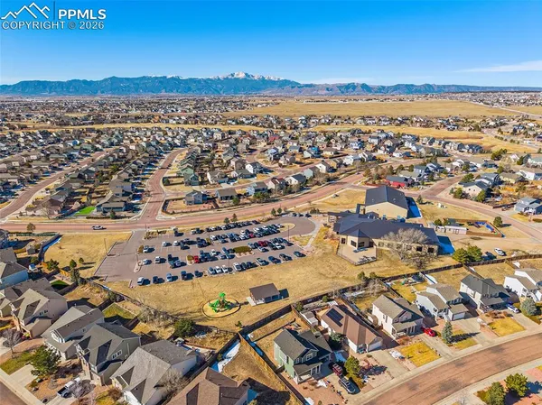 an aerial view of residential houses and outdoor space