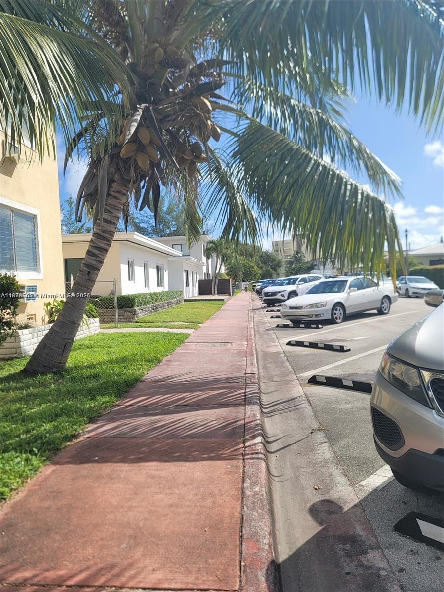 895 80th Street, Unit C Miami Beach, FL 33141 - Photo 4 of 4 a view of yard with swimming pool and furniture