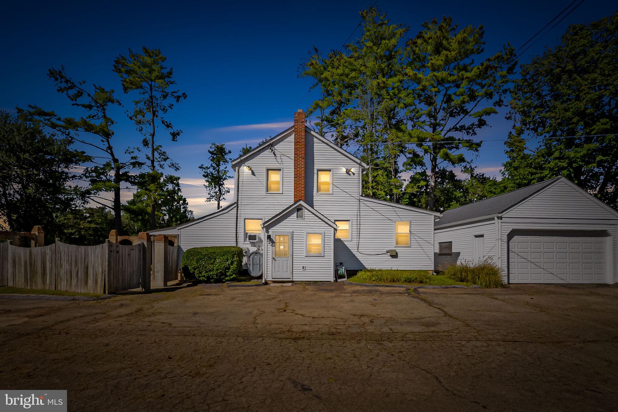 315 Brick Church Road Davidsonville, MD 21035 - Photo 1 of 45 a front view of a house with a yard and garage