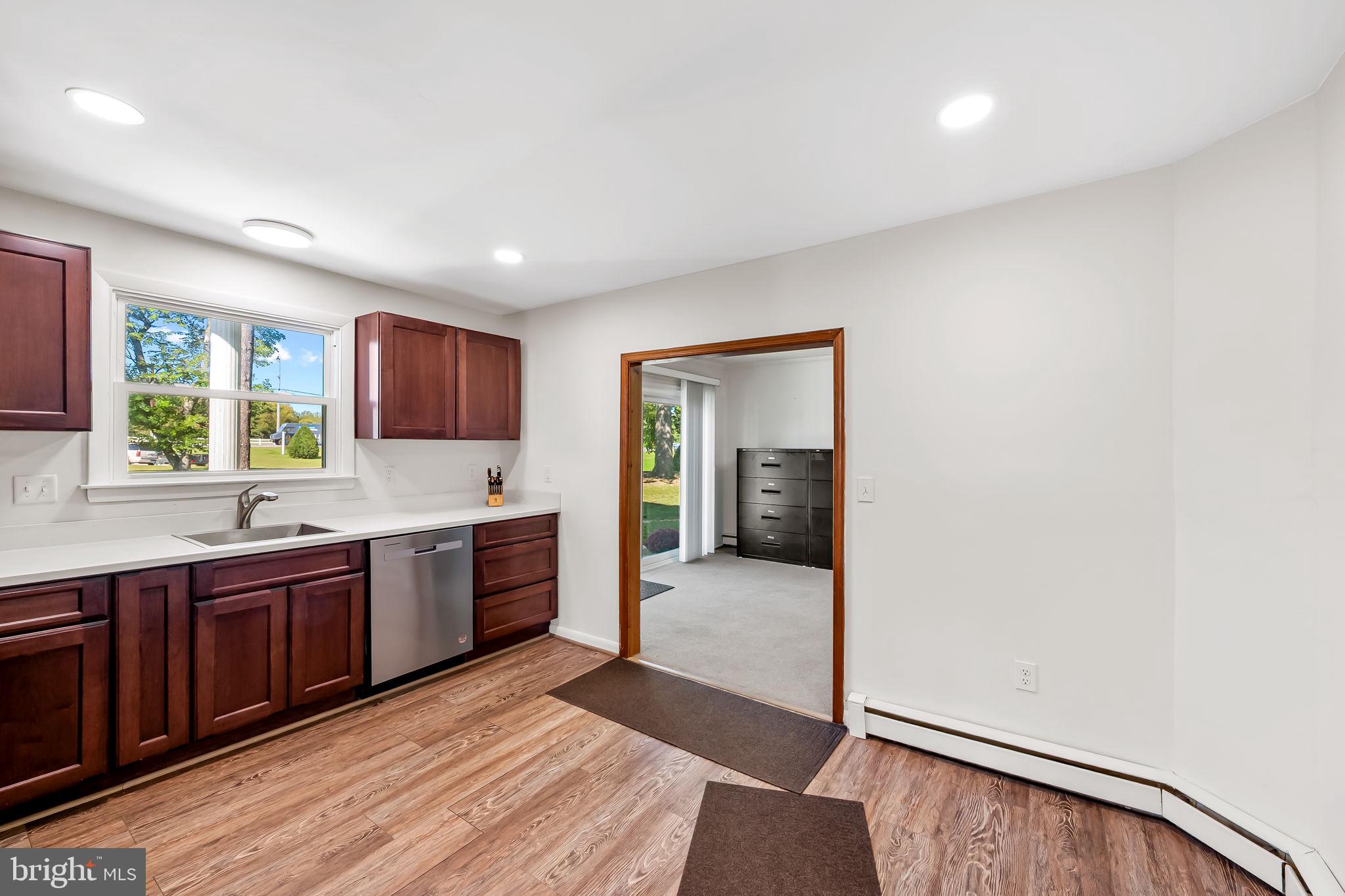 315 Brick Church Road Davidsonville, MD 21035 - Photo 12 of 45 a large kitchen with stainless steel appliances granite countertop a sink and cabinets