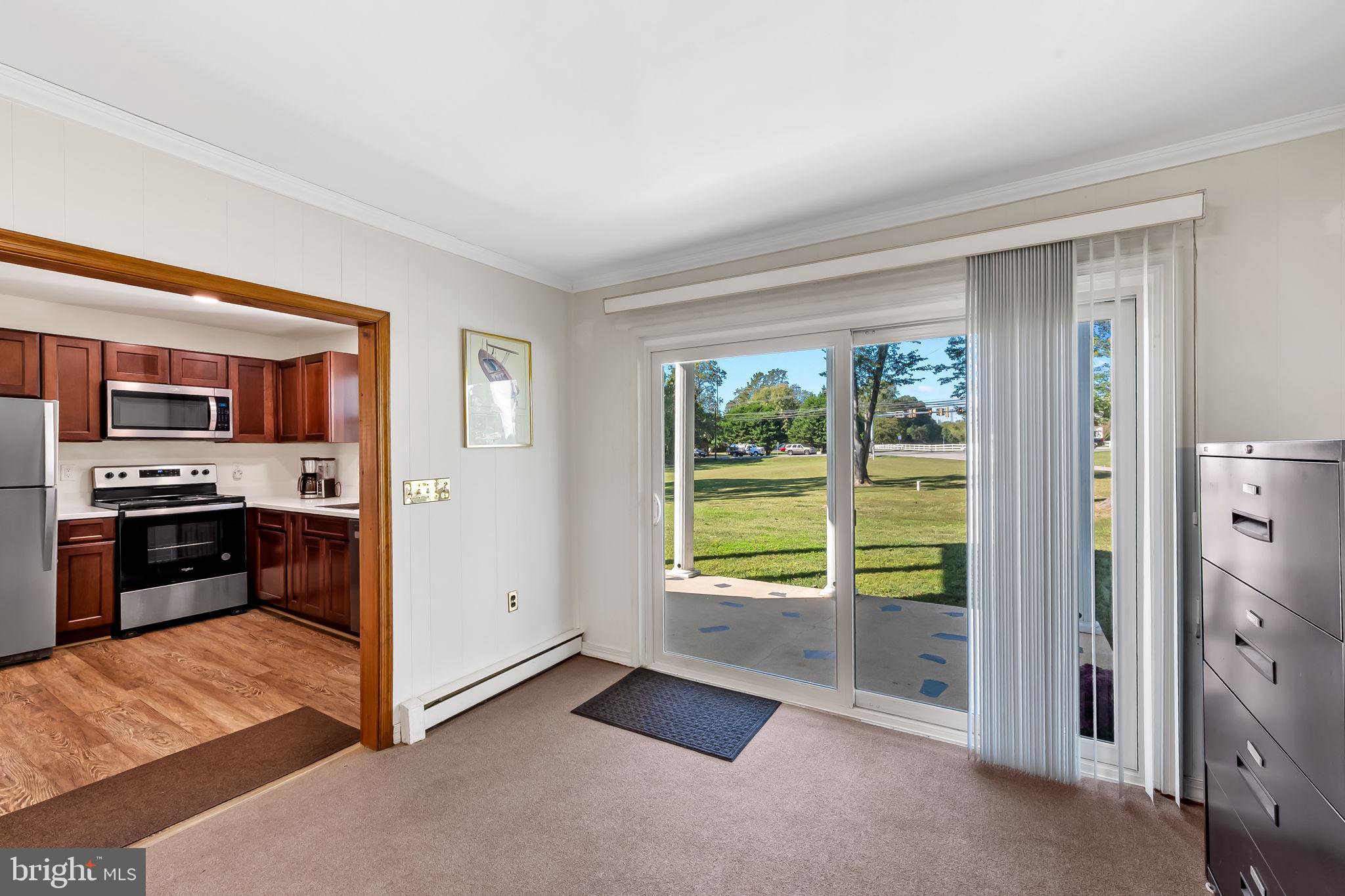 315 Brick Church Road Davidsonville, MD 21035 - Photo 15 of 45 a view of a kitchen with an empty room and a window