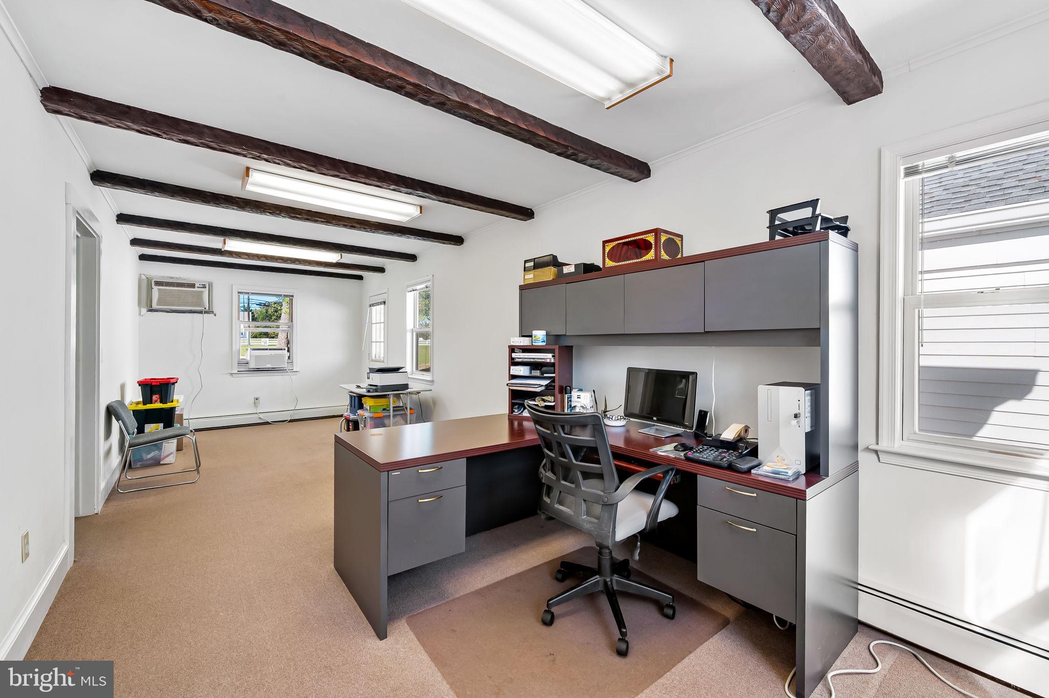 315 Brick Church Road Davidsonville, MD 21035 - Photo 17 of 45 a view of a workspace with furniture and a window